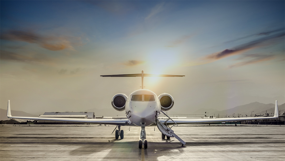 Private jet parked at sunset at Raleigh Executive Jetport
