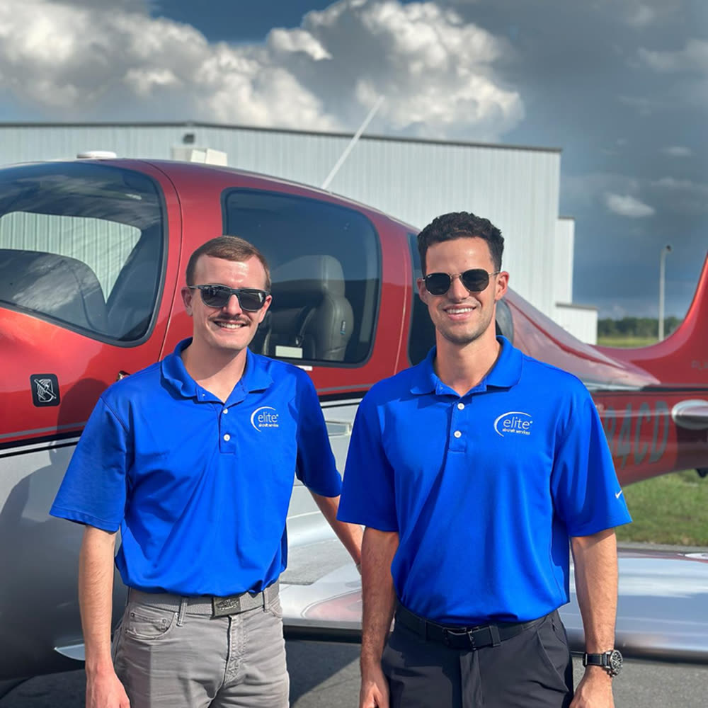 Elite Aircraft Services team members beside a rental aircraft on the ramp at Raleigh Executive Jetport